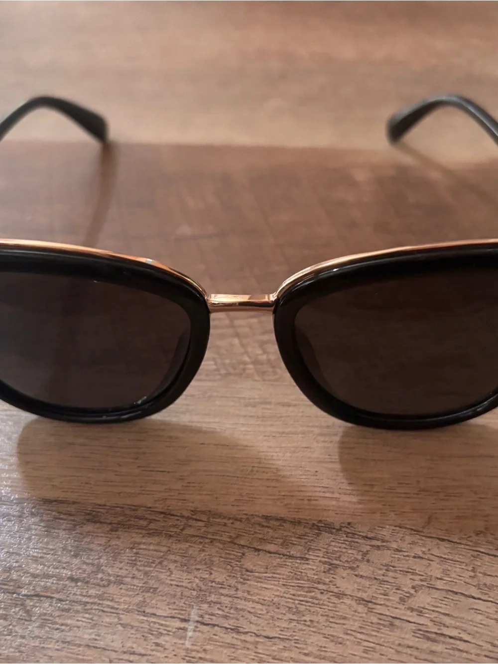 Black Oval Sunglasses with Gold Bridge